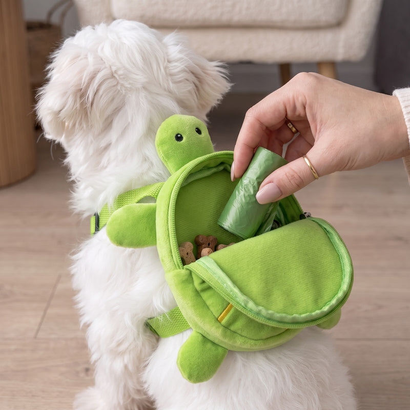 Packing poop bags into the turtle shell pocket